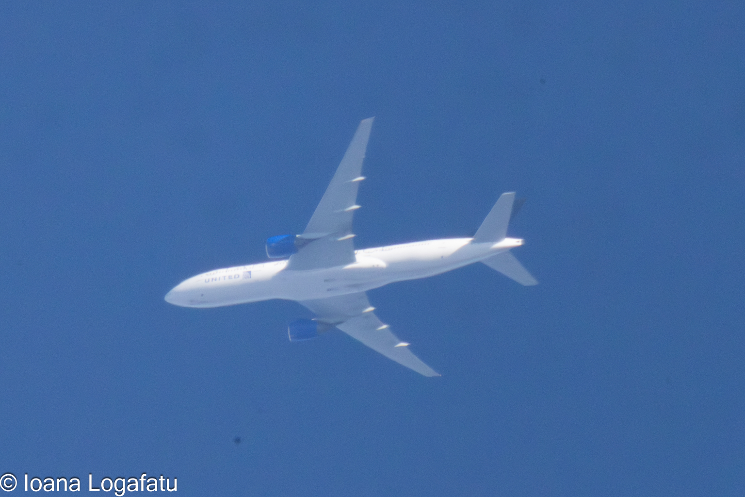 High above the clouds, a plane glides silently